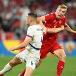 Denmark progress to last 16 after tense goalless draw with Serbia