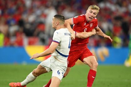 Denmark progress to last 16 after tense goalless draw with Serbia