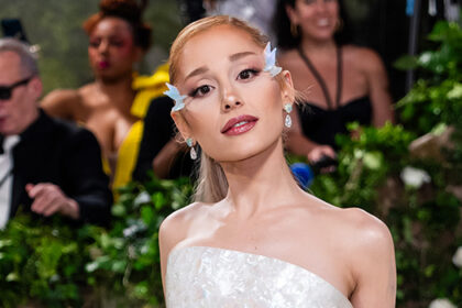 Ariana Grande posing in a white gown at the 2024 Met Gala