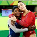 RIO DE JANEIRO, BRAZIL - AUGUST 11:  Simone Biles (L) of the United States waits for the score after competing on the floor with Alexandra Raisman (R) during the Women's Individual All Around Final on Day 6 of the 2016 Rio Olympics at Rio Olympic Arena on August 11, 2016 in Rio de Janeiro, Brazil.  (Photo by Alex Livesey/Getty Images)