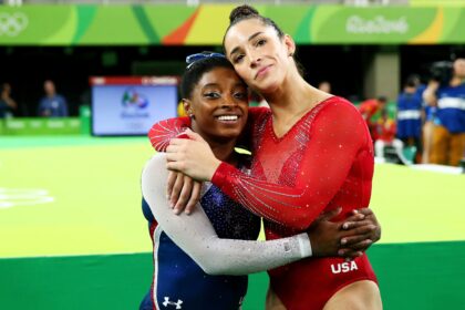 RIO DE JANEIRO, BRAZIL - AUGUST 11:  Simone Biles (L) of the United States waits for the score after competing on the floor with Alexandra Raisman (R) during the Women's Individual All Around Final on Day 6 of the 2016 Rio Olympics at Rio Olympic Arena on August 11, 2016 in Rio de Janeiro, Brazil.  (Photo by Alex Livesey/Getty Images)