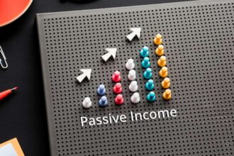 Passive income text with pin graph chart on business table