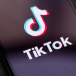 An image of the TikTok logo on a phone screen