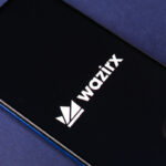 The WazirX logo on a phone