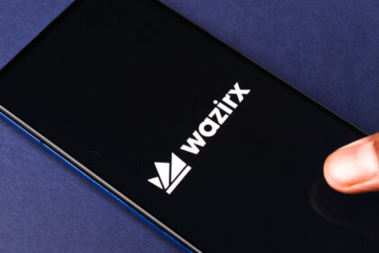 The WazirX logo on a phone