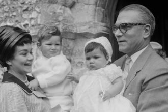 English actors Joan Plowright, holding son Richard, and Laurence Olivier (1907-1989) pictured attending the christening of their daughter Tamsin at a church in England on 15th July 1963. (Photo by Stanley Sherman/Express/Hulton Archive/Getty Images)