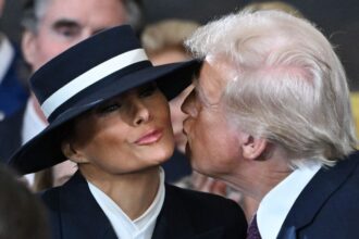 WASHINGTON, DC - JANUARY 20: U.S. President-elect Donald Trump kisses Melania Trump at his inauguration in the U.S. Capitol Rotunda on January 20, 2025 in Washington, DC. Donald Trump takes office for his second term as the 47th President of the United States. (Photo by Saul Loeb-Pool/Getty Images)