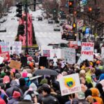 Thousands converge on Washington for a march days before Trump takes office