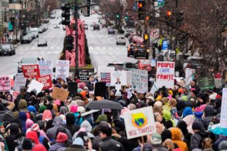 Thousands converge on Washington for a march days before Trump takes office