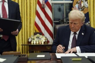 Trump pardons 6 January perpetrators as he signs slew of executive orders on first day in office